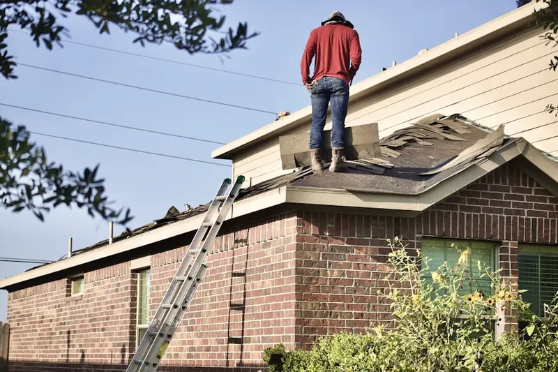 Professional roofer working on a residential roof in West Severna Park